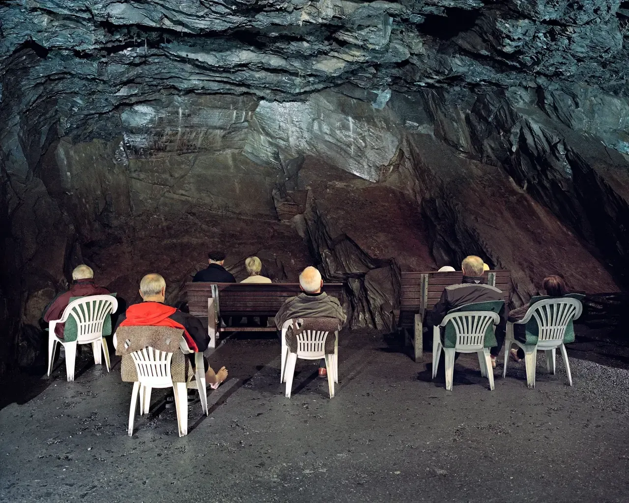 BYOC workshop visual — people gathered in a cave